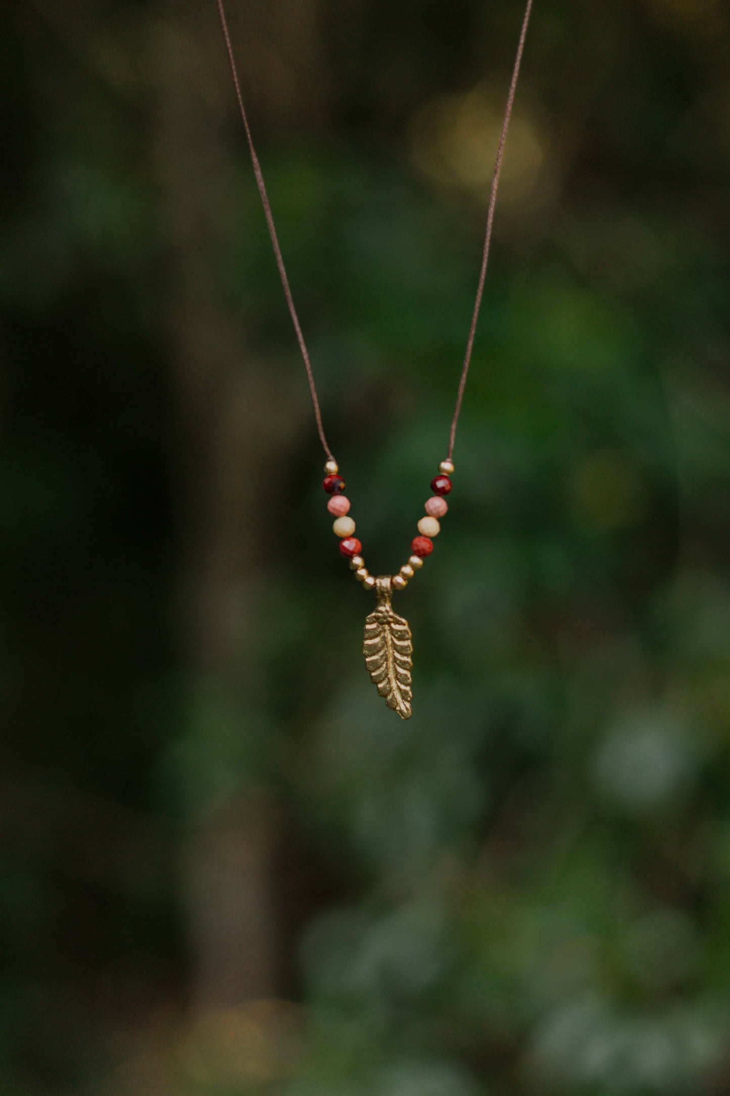 Dainty faceted mookaite and brass leaf necklace