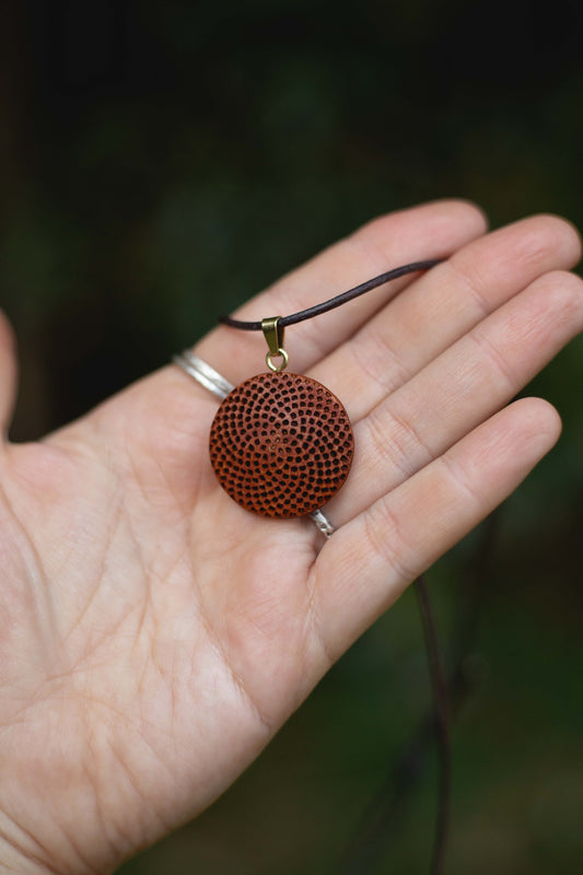 Carved protea seed necklace